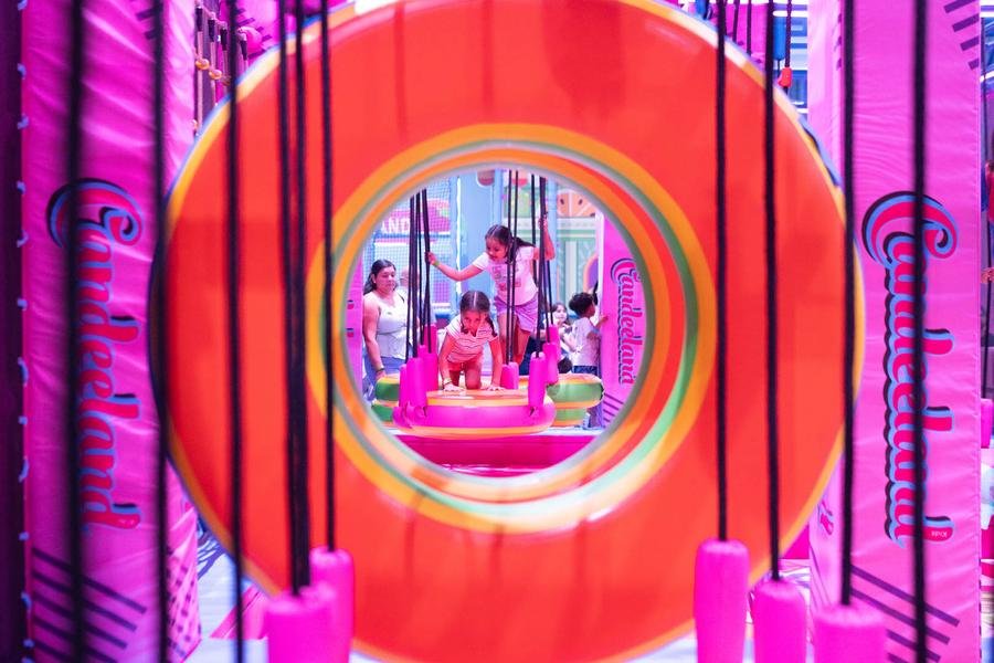 Kids climbing through the ring swings