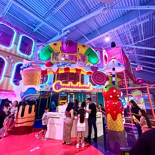 Families at the candy-themed check-in area inside Candeeland El Centro
